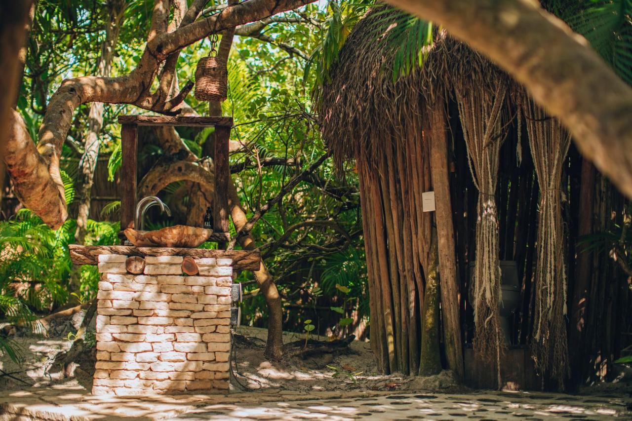 Ikal Tulum Hotel Exterior photo A fountain in the jungle