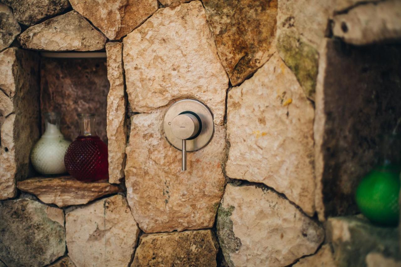 Ikal Tulum Hotel Exterior photo A modern stone-framed window in a hobbit hole